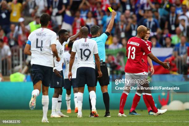 Referee Sandro Ricci shows Mathias Jorgensen of Denmark a yellow card during the 2018 FIFA World Cup Russia group C match between Denmark and France...