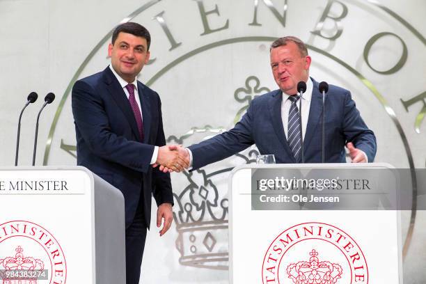 Ukrainian Prime Minister Volodymy Groysman and Danish Prime Minister Lars Loekke Rasmusseen shake hands during a joint press conference prior to the...