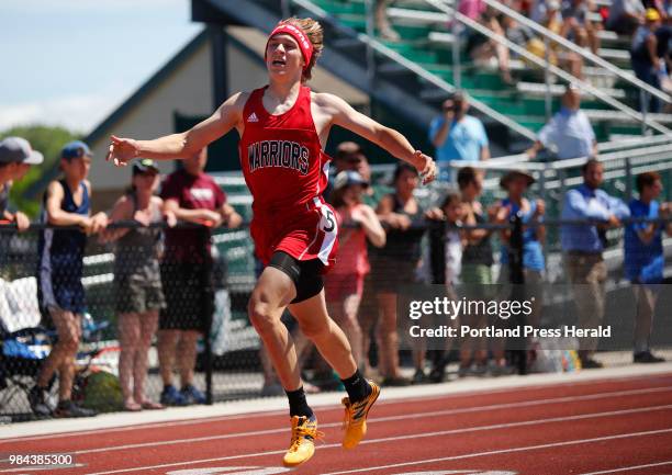 Brian Niznik of Wells pulls away to win the 400 meter dash at the Class C state championship track meet.