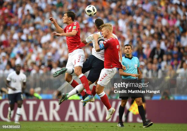 Olivier Giroud of France is challenged by Andreas Christensen and Simon Kjaer of Denmark during the 2018 FIFA World Cup Russia group C match between...