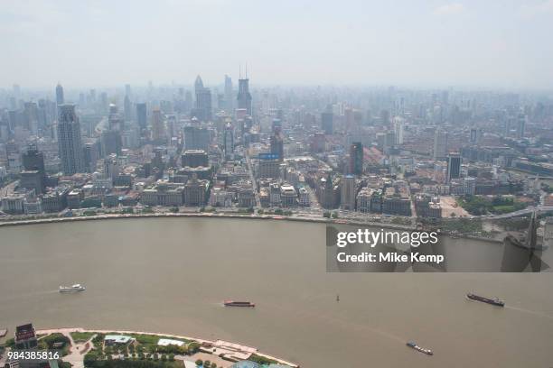 View looking from The Oriental Pearl Tower in Pudong, across the Huang Pu River to Puxi Shanghais downtown area in Shanghai, China. The Bunds western...