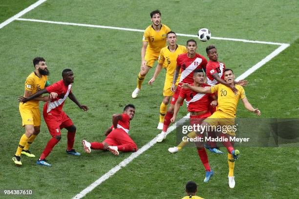 Anderson Santamaria, Pedro Aquino of Peru, and Trent Sainsbury of Australia compete for a header during the 2018 FIFA World Cup Russia group C match...