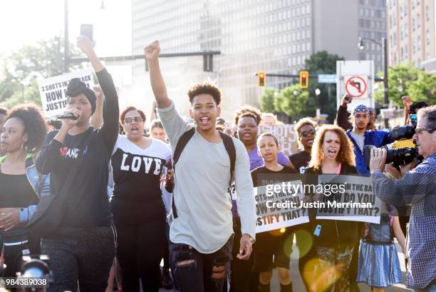 Christian Carter of East Liberty, Pennsylvania, leads protesters a day after the funeral of Antwon Rose II on June 26, 2018 in Pittsburgh,...