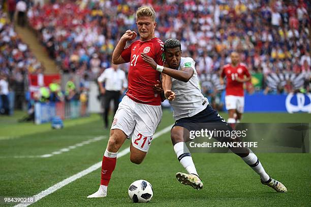 Denmark's forward Andreas Cornelius vies with France's defender Presnel Kimpembe during the Russia 2018 World Cup Group C football match between...
