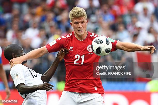Denmark's forward Andreas Cornelius vies with France's midfielder N'Golo Kante during the Russia 2018 World Cup Group C football match between...