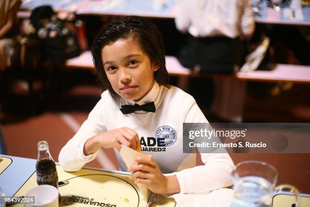 Kid model poses during the Caten Hight Shool Prom DSquared2 as a part of Pitti Bimbo Kids Fashion Week at Palamattioli on June 21, 2018 in Florence,...