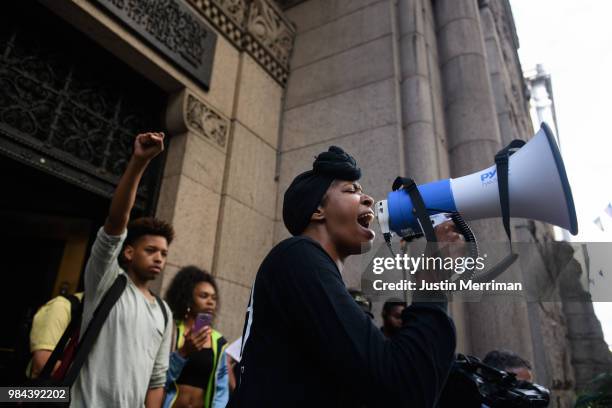 Organizer Nicky Jo Dawson leads a protest a day after the funeral of Antwon Rose II on June 26, 2018 on the steps of the Allegheny County Courthouse...