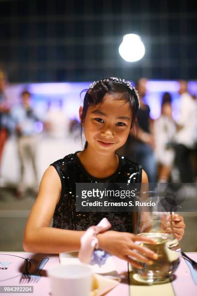 Kid model poses during the Caten Hight Shool Prom DSquared2 as a part of Pitti Bimbo Kids Fashion Week at Palamattioli on June 21, 2018 in Florence,...