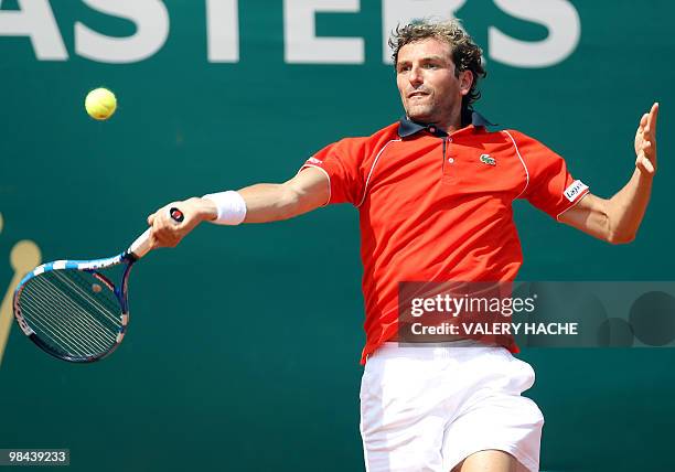 French Julien Benneteau hits a return to his Spanish opponent Fernando Verdasco during the Monte-Carlo ATP Masters Series Tournament tennis match, on...