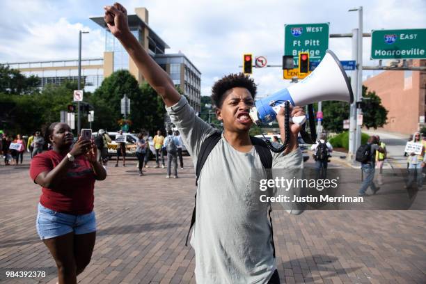 Christian Carter of East Liberty, Pennsylvania leads protesters as they block a major downtown intersection a day after the funeral of Antwon Rose II...