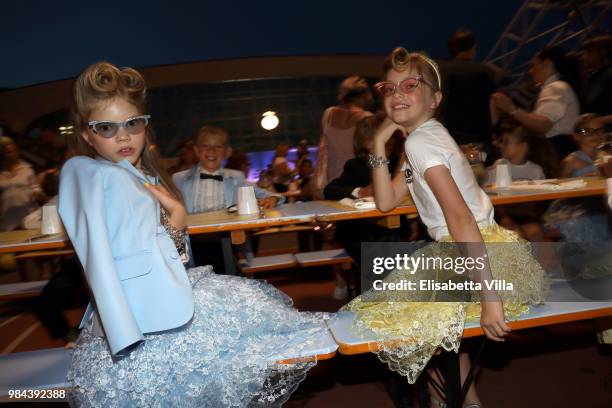 Models pose for a photo at the Caten Hight School Prom DSquared2 as a part of Pitti Bimbo Kids Fashion Week at Palamattioli on June 21, 2018 in...