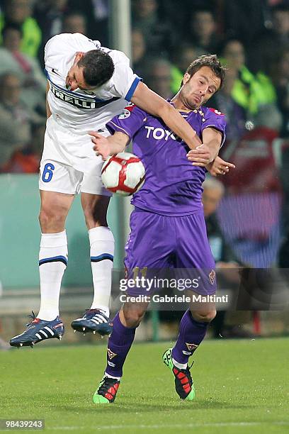 Alberto Gilardino of ACF Fiorentina battles for the ball with Lucio of FC Internazionale Milano during the Tim Cup ACF Fiorentina and FC...