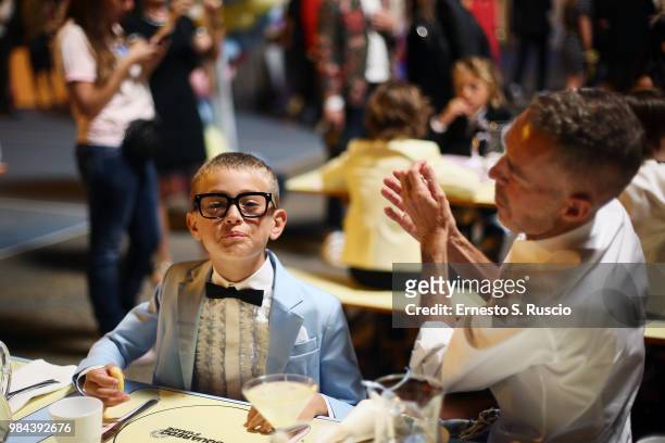 Fashion designers, founders and owners of Dsquared2 Dan Caten with kid model attend the Caten Hight Shool Prom Dsquared2 as a part of Pitti Bimbo...