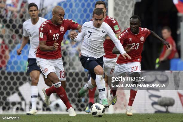 France's forward Antoine Griezmann vies with Denmark's defender Mathias Jorgensen and Denmark's forward Pione Sisto during the Russia 2018 World Cup...