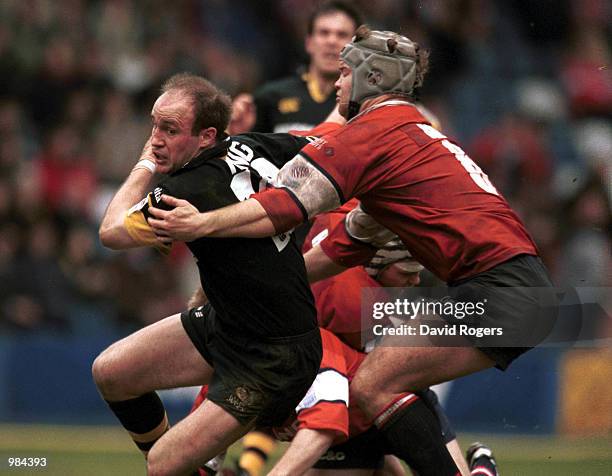 Alex King of Wasps is stopped by Jake Boer of Gloucester during the match between London Wasps and Gloucester in the Zurich Championship Play Off...