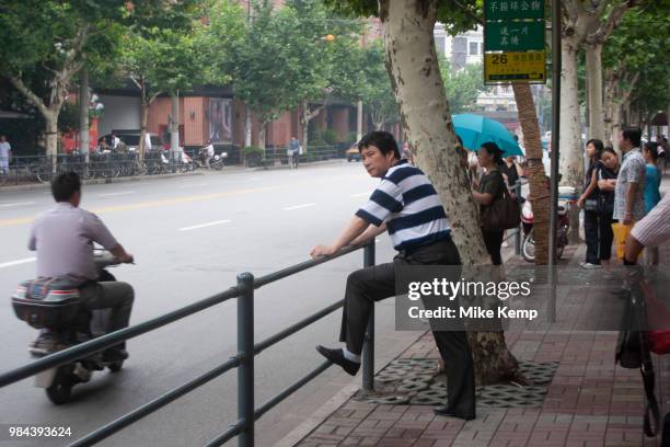 Street scene with moped traffic in Shanghai, China.