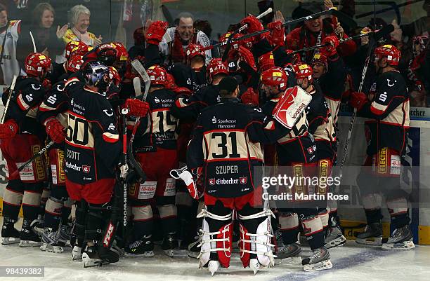 The team of Hannover celebrate after winning the third DEL play off semi final match between Hannover Scorpions and ERC Ingolstadt at TUI Arena on...