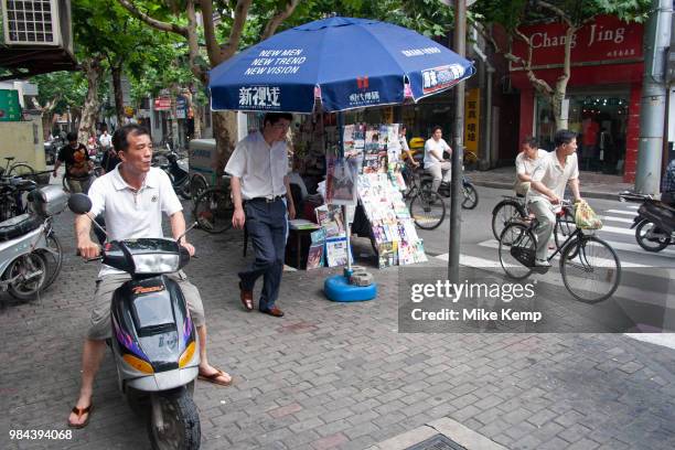 Street scene with moped traffic in Shanghai, China.