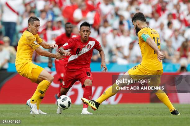 Peru's midfielder Christian Cueva vies for the ball with Australia's defender Mark Milligan and Australia's midfielder Mile Jedinak during the Russia...