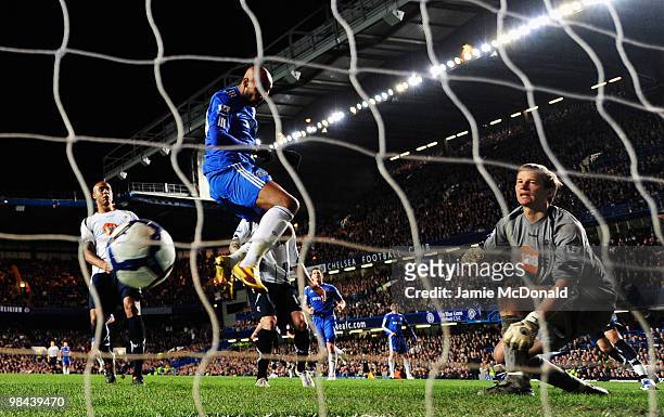 Nicolas Anelka of Chelsea scores their first goal with a header to beat Jussi Jaaskelainen of Bolton Wanderers during the Barclays Premier League...