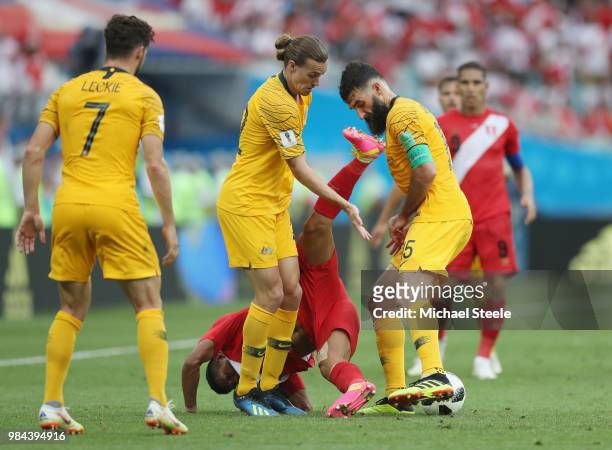 Edison Flores of Peru is challenged by aus22 and Mile Jedinak of Australia during the 2018 FIFA World Cup Russia group C match between Australia and...