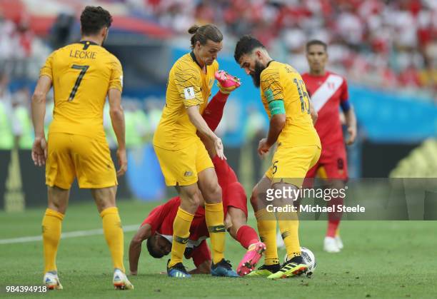 Edison Flores of Peru is challenged by aus22 and Mile Jedinak of Australia during the 2018 FIFA World Cup Russia group C match between Australia and...