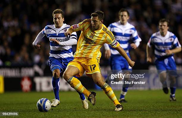 Newcastle United player Alan Smith beats Brian Howard of Reading to the ball during the Coca-Cola Championship game between Reading and Newcastle...