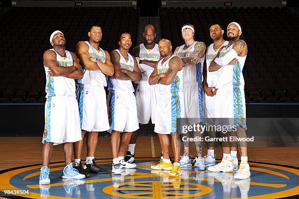 Ty Lawson, Joey Graham, J.R. Smith, Johan Petro, Anthony Carter, Chris Andersen, Malik Allen and Renaldo Balkman of the Denver Nuggets pose for a...