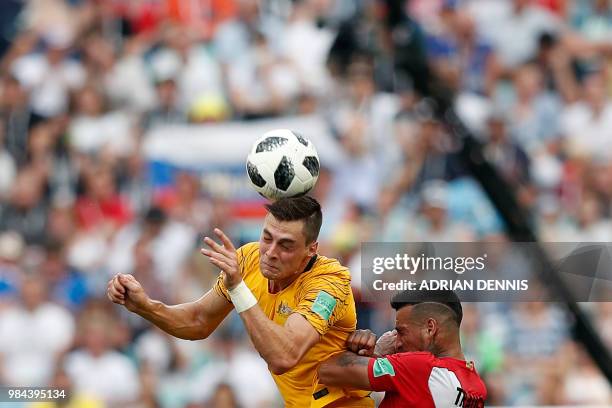 Australia's forward Tomi Juric jumps for the ball with Peru's defender Miguel Trauco during the Russia 2018 World Cup Group C football match between...