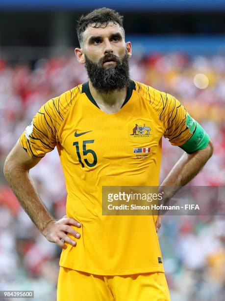 Mile Jedinak of Australia looks dejected following his sides defeat in the 2018 FIFA World Cup Russia group C match between Australia and Peru at...