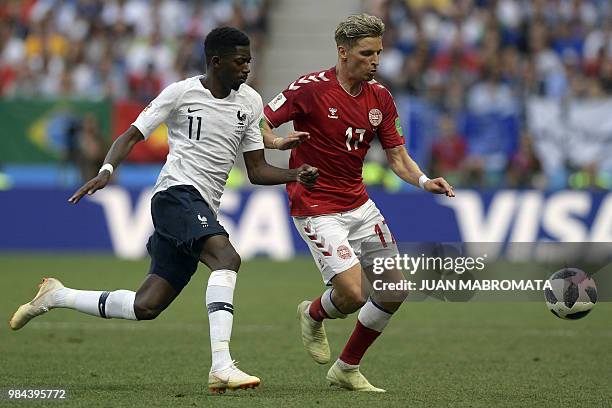 France's forward Ousmane Dembele vies with Denmark's defender Jens Stryger Larsen during the Russia 2018 World Cup Group C football match between...