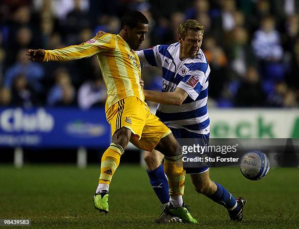 Newcastle United player Wayne Routledge looses possesion to Bryn Gunnarsson of Reading during the Coca-Cola Championship game between Reading and...