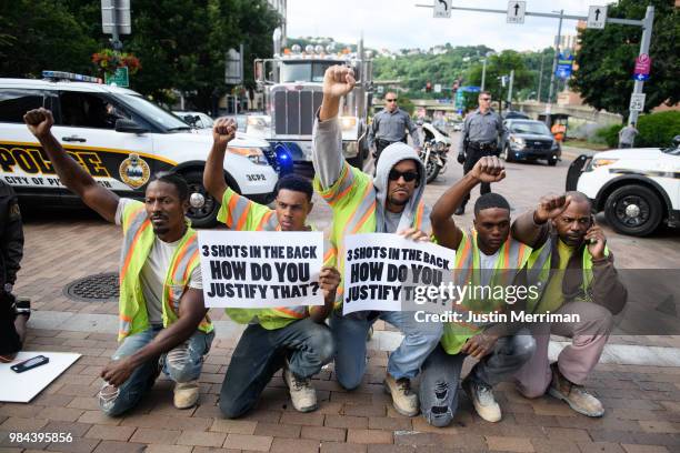 Construction workers who walked off the job join a protest a day after the funeral of Antwon Rose II on June 26, 2018 in Pittsburgh, Pennsylvania....