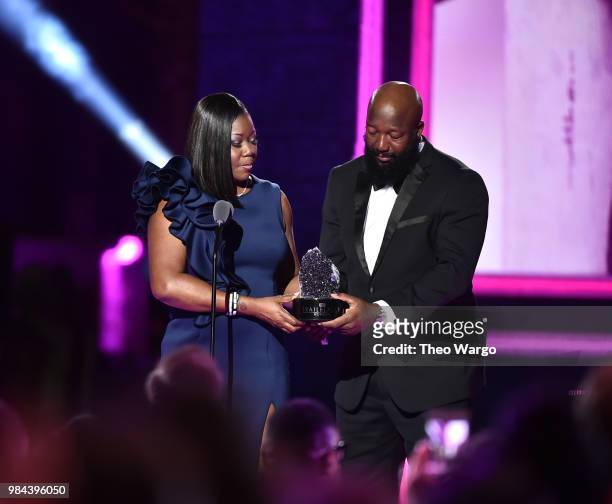 Honorees Sybrina Fulton and Tracy Martin celebrate on stage during VH1 Trailblazer Honors 2018 at The Cathedral of St. John the Divine on June 21,...