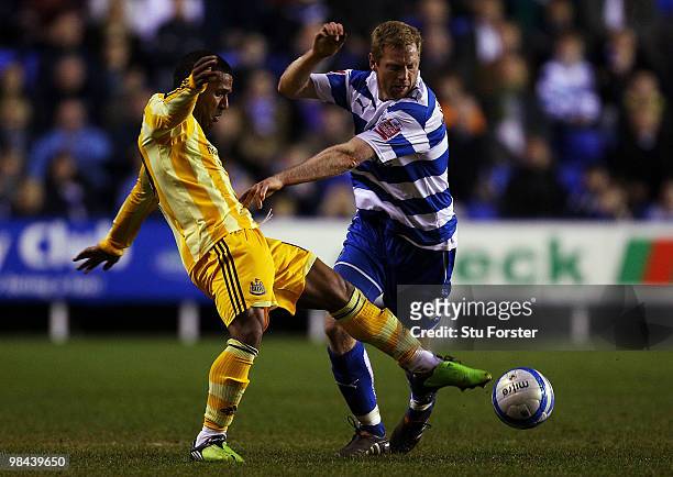 Newcastle United player Wayne Routledge loses possesion to Bryn Gunnarsson of Reading during the Coca-Cola Championship game between Reading and...