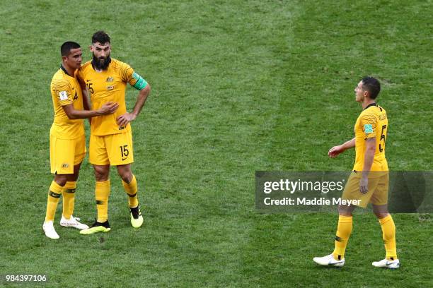 Tim Cahill, Mile Jedinak and Mark Milligan of Australia look dejected following their sides defeat in the 2018 FIFA World Cup Russia group C match...