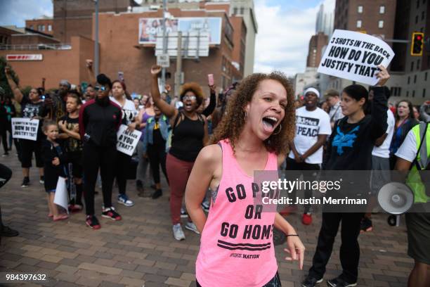 Marie Hudzinski, a cousin of Antwon Rose II, yells at an angry motorist at a protest a day after the funeral of Rose that blocked streets on June 26,...