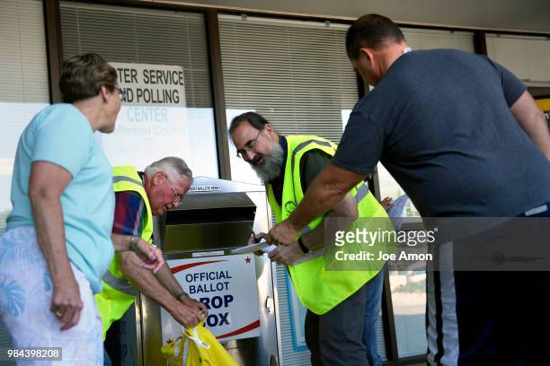 Transportation Election Judges picking up ballots at the Jefferson County DMV June 26, 2018 in Arvada, Colorado.