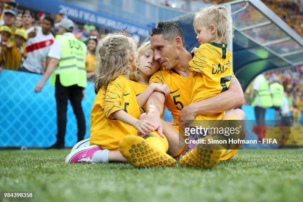 Mark Milligan of Australia speaks with his children after the 2018 FIFA World Cup Russia group C match between Australia and Peru at Fisht Stadium on...