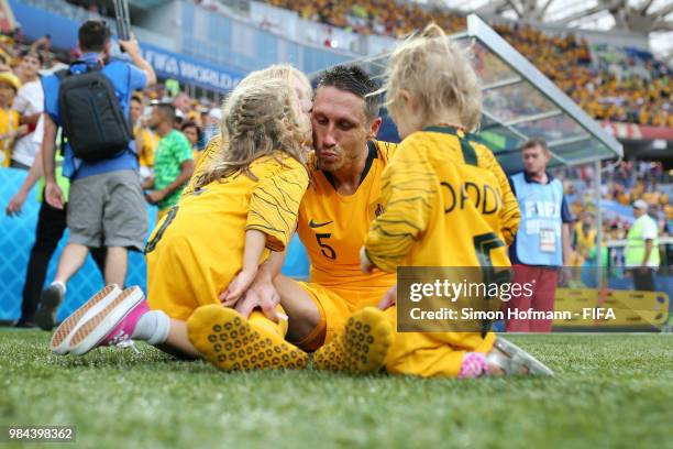 Mark Milligan of Australia speaks with his children after the 2018 FIFA World Cup Russia group C match between Australia and Peru at Fisht Stadium on...