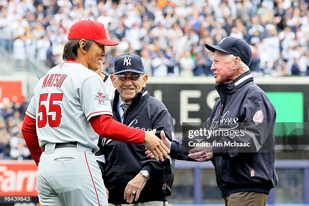 Hideki Matsui of the Los Angeles Angels of Anaheim greets former Yankees Yogi Berra and Whitey Ford as Matsui receives his 2009 World Series ring...