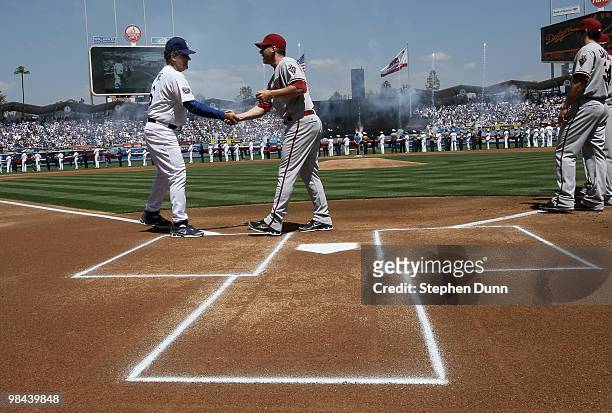 Manager Joe Torre of the Los Angeles Dodgers greets manager A.J. Hinch of the Arizona Diamondbacks on April 13, 2010 at Dodger Stadium in Los...
