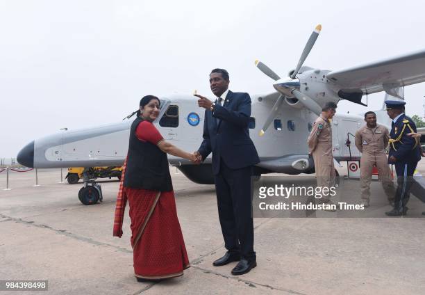Minister of External Affairs Sushma Swaraj shakes hand with Seychelles President Danny Antoine Rollen Faure during the handing over of a Dornier...