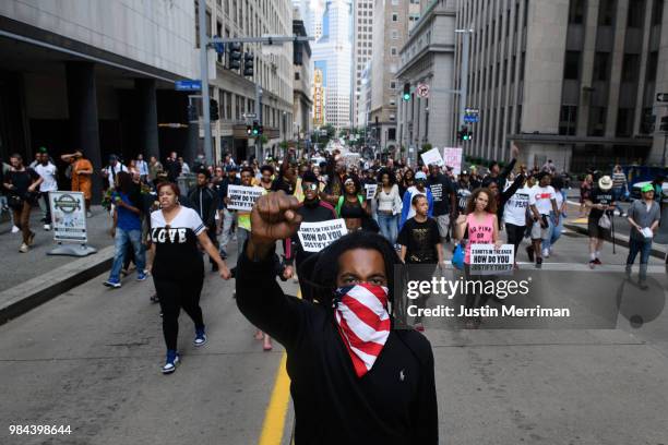 Trey Willis of Washington, Pennsylvania marches during a protest a day after the funeral for Antwon Rose II on June 26, 2018 in downtown Pittsburgh,...