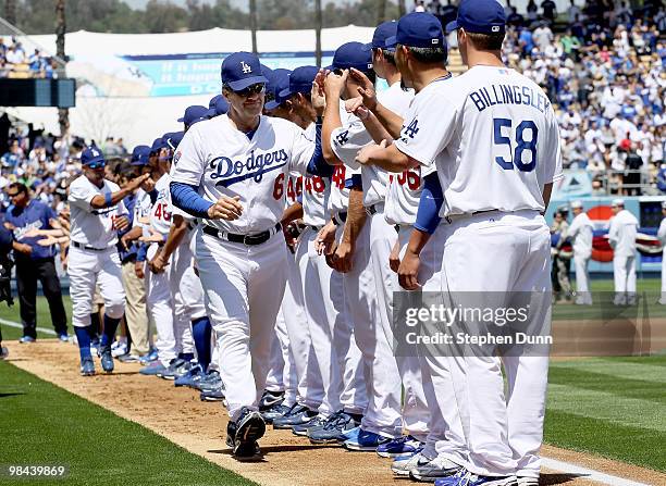 Manager Joe Torre of the Los Angeles Dodgers greets his team during opening day introductions before the game with the Arizona Diamondbacks on April...