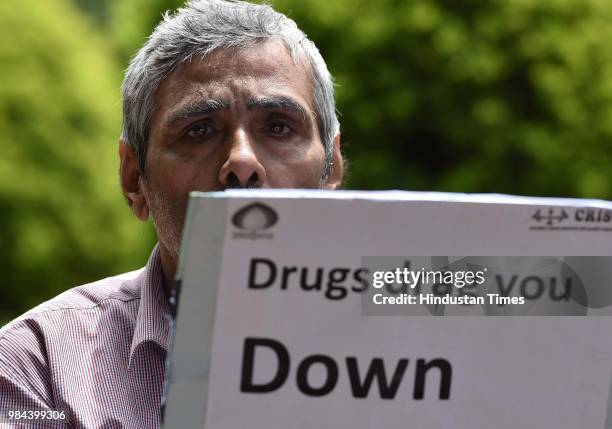 Rehabilitated person takes part in an awareness campaign with other victims and doctors along with the activists on the International Day against...