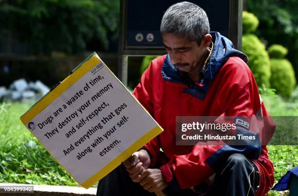 Rehabilitated person takes part in an awareness campaign with other victims and doctors along with the activists on the International Day against...