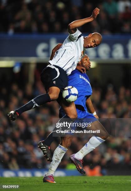 Zat Knight of Bolton Wanderers challenges Didier Drogba of Chelsea during the Barclays Premier League match between Chelsea and Bolton Wanderers at...