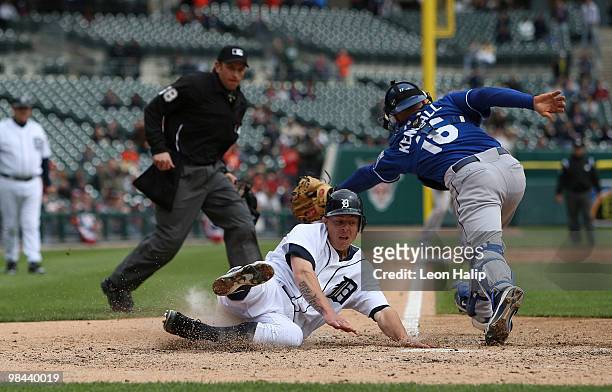 Brandon Inge of the Detroit Tigers scores from second base on a double to center field off the bat of Gerald Laird in the seventh inning during their...