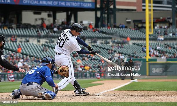 Scott Sizemore of the Detroit Tigers doubles down the left field line in the seventh inning scoring Gerald Laird from second base against the Kansas...